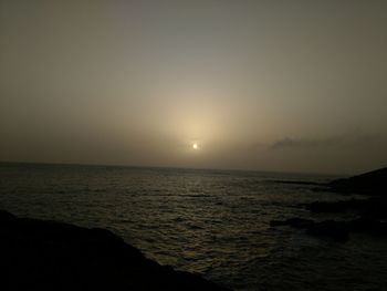 Scenic view of sea against clear sky during sunset