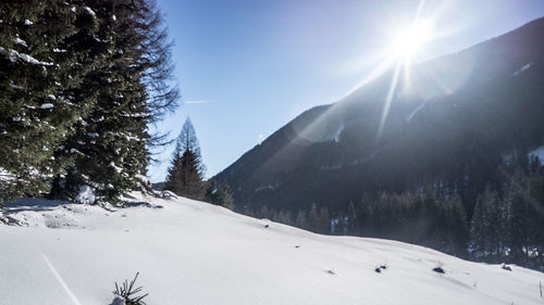 Scenic view of snow covered mountains against sky