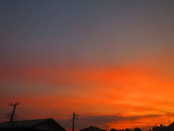 Silhouette bridge against sky during sunset