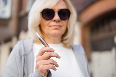 Close-up of woman wearing sunglasses