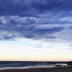 Scenic view of sea at sunset