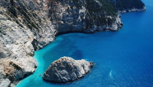 High angle view of rock formations in sea