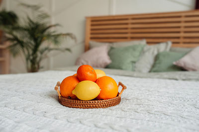 Close-up of orange fruit on table at home