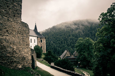 View of building fog and forest