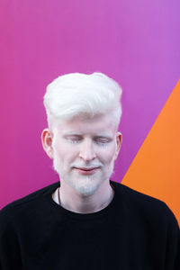 Portrait of an albino man with eyes closed