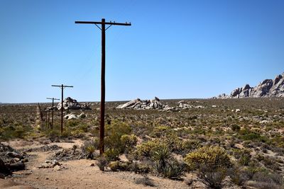 Scenic view of land against clear blue sky