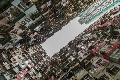 Directly below view of buildings against sky