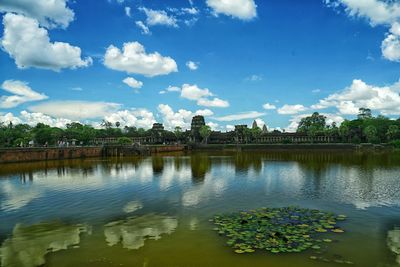 Scenic view of calm lake against blue sky