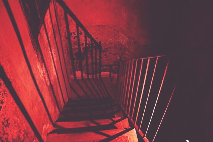 steps, steps and staircases, red, staircase, built structure, architecture, indoors, railing, low angle view, the way forward, wall - building feature, illuminated, no people, stairs, diminishing perspective, building, night, building exterior, sunlight