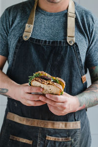 Midsection of man holding food