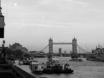 View of suspension bridge against cloudy sky