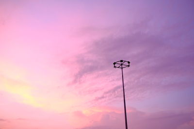 Low angle view of street light against dramatic sky