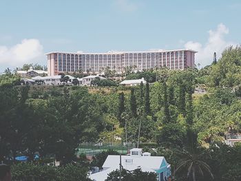 High angle view of trees and buildings against sky