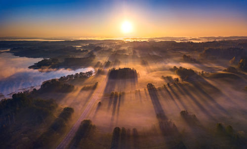 Aerial view of landscape against sky during sunset