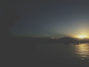 Scenic view of sea against sky at night
