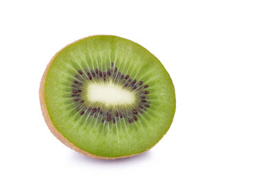 Close-up of lemon slice over white background