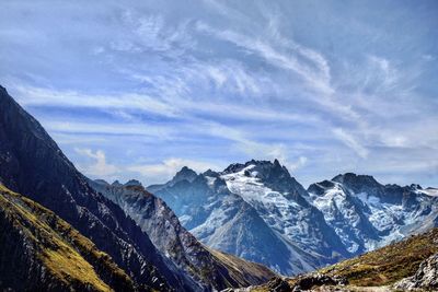 Scenic view of snowcapped mountains against sky