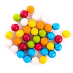 High angle view of multi colored candies against white background