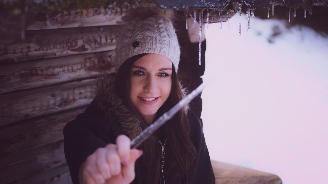 one person, portrait, front view, young adult, young women, real people, holding, lifestyles, looking at camera, clothing, headshot, winter, beautiful woman, beauty, warm clothing, hat, leisure activity, cold temperature, hairstyle, scarf