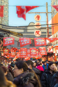 People in city against sky
