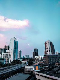 Modern buildings in city against sky