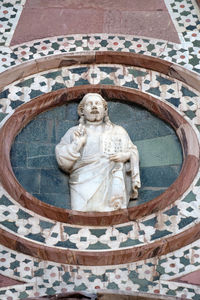 Low angle view of statue against temple