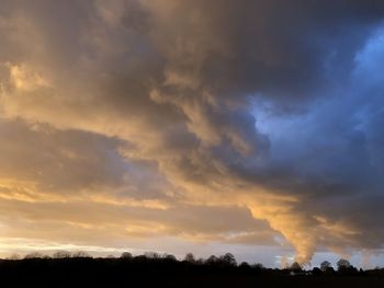 Scenic view of dramatic sky during sunset