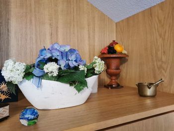 Close-up of potted plants on wooden table