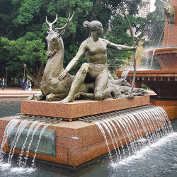 Statue of fountain against trees