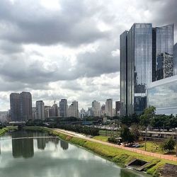 Cityscape against cloudy sky