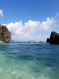 Scenic view of sea against blue sky