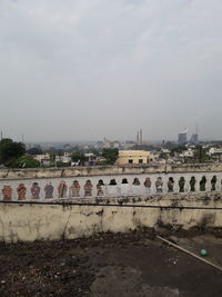 Graffiti on wall of building against sky