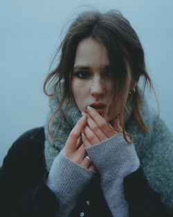 Portrait of young woman outdoors