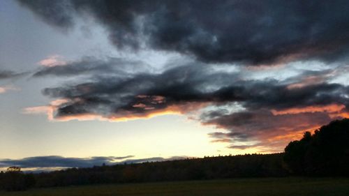 Scenic view of landscape against cloudy sky