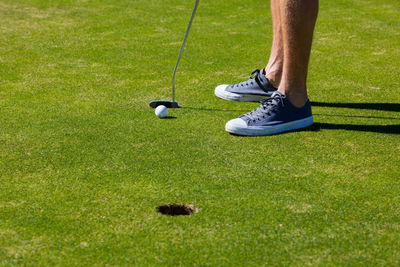 Low section of man on golf course