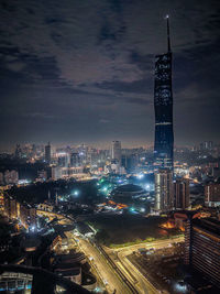 High angle view of illuminated cityscape against sky at night