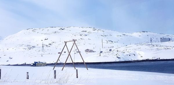 Scenic view of frozen landscape against sky