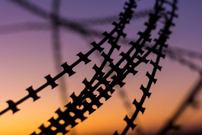 Low angle view of telephone pole against sky