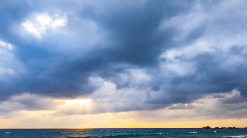 Scenic view of sea against dramatic sky