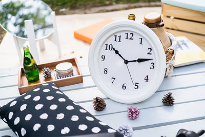 Close-up of clock on table