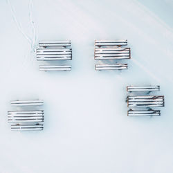 High angle view of snow covered benches