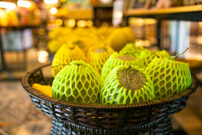 Cantaloupe melon sold in market wrap by foam covering fruit.