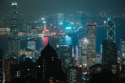 Illuminated modern buildings in city at night