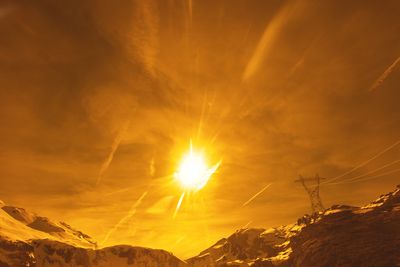 Scenic view of mountains against sky during sunset