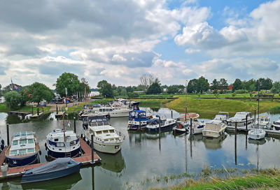 Boats moored at harbor