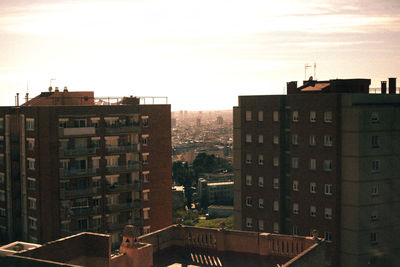 High angle view of buildings in city against sky