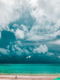 Scenic view of sea against cloudy sky