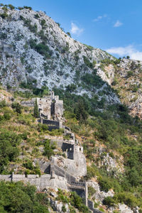 Built structure on mountain against sky