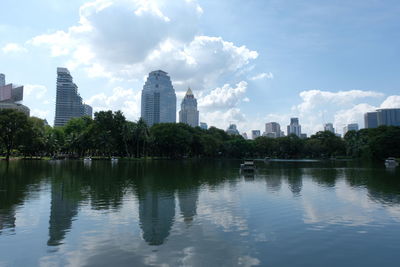 Scenic view of city by buildings against sky