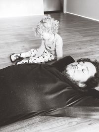 Man and child relaxing on floor